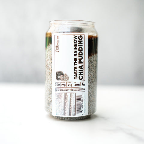 A clear can shows layered dark and light chia pudding. The label reads Taste The Rainbow Chia Pudding (Subscription), featuring a low-sugar, high-protein dessert and nutrition facts on a white label with black text.