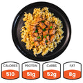 The BBQ Chicken Mac Bowl features rotini pasta and grilled chicken, garnished with herbs. This healthy meal has 510 calories, 51g protein, 52g carbs, and 8g fat—ideal for meal prep.