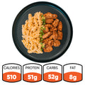 A black plate with BBQ Chicken Mac Bowl pasta, garnished with green onions. This Hummus Fit healthy meal prep has 510 calories, 51g protein, 52g carbs, and 8g fat.