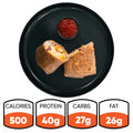 The Breakfast Burrito, sliced in half on a black plate with red salsa, delivers 500 calories, 40g protein, 27g carbs, and 26g fat—ideal for high-protein meal prep.
