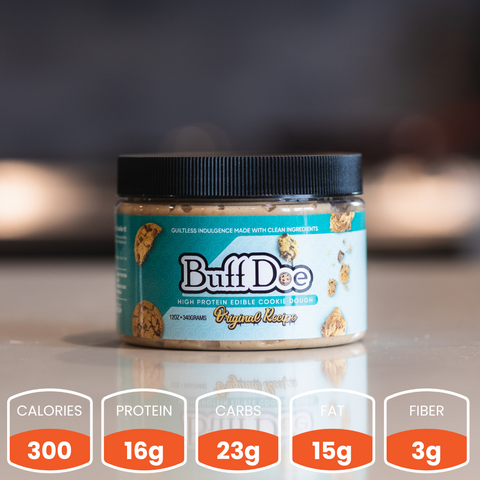 A jar of Buffdoe Original Recipe - Subscription high protein chocolate chip cookie dough sits on the counter—guilt-free with 300 calories, 16g protein, 23g carbs, 15g fat, and 3g fiber per serving. Nutrition facts below.
