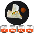 The Buffalo Crispy Chicken Wrap, cut in half on a black plate with fat-free ranch, packs 390 calories, 38g protein, 45g carbs, and 6g fat—making it a healthy meal prep option.