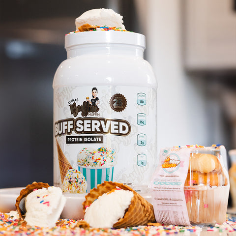 A large white tub labeled Lianas Buffin Muffin - Protein Isolate features an ice cream cone and sprinkles design, emphasizing its dessert-inspired flavors. Beside it sit ice cream cones, sprinkles, and a clear container of muffins.