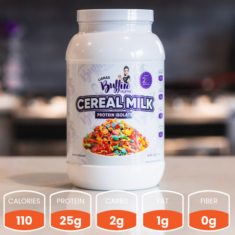 A white container of Lianas Buffin Muffin - Protein Isolate (Subscription) sits on a kitchen counter. Its label features colorful cereal in milk. Each serving: 110 calories, 25g protein, 2g carbs, 1g fat, and 0g fiber.