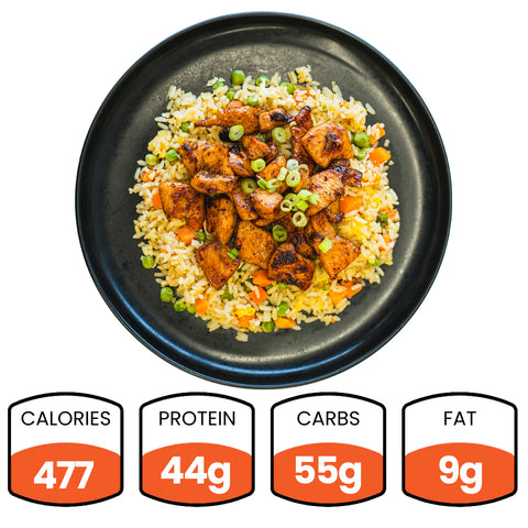 Chicken Stir Fry: Gochujang teriyaki chicken on fried rice with veggies, topped with green onions. High-protein meal—477 calories, 44g protein, 55g carbs, and 9g fat. Perfect for a quick, healthy dinner.