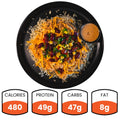 The Chicken Taco Bowl features shredded grilled chicken breast over rice, topped with beans, corn, peppers, cheese, and sauce. Each bowl has 480 calories, 49g protein, 47g carbs, and 8g fat—a high-protein meal.