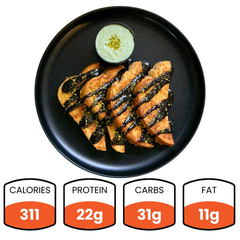 Enjoy our Chocolate Pistachio French Toast—delicious toasted slices drizzled with chocolate sauce, served on a black plate with dip. Nutrition: 311 calories, 22g protein, 31g carbs, and 11g fat per serving.