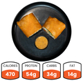 The Club Wrap - Subscription features a high-protein chicken wrap cut in half on a black plate with dipping sauce. Below, the nutrition info reads: 470 calories, 54g protein, 34g carbs, and 14g fat—ideal for healthy meal prep.