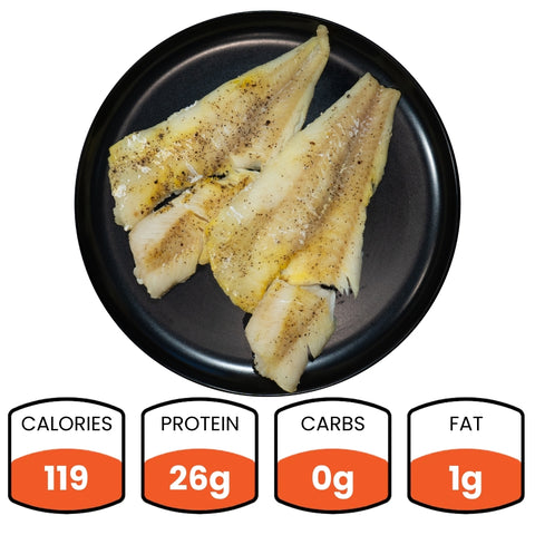 Two seasoned white fish fillets—Competition Approved Oven Baked Cod (1lb)—make an ideal protein, competition-ready seafood meal: 119 calories, 26g protein, 0g carbs, and 1g fat.