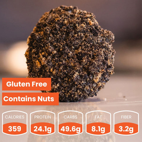 A Buffin Muffin, a chocolate-covered snack ball, sits on a surface. Text highlights it as gluten-free and nut-containing—ideal for on-the-go. Each has 359 calories, 24.1g protein, 49.6g carbs, 8.1g fat, and 3.2g fiber.