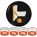 The Crispy Vegan Wrap is served on a black plate with a dip, offering 370 calories, 31g protein and fiber, 40g carbs, and 12g fat—a perfect healthy lunch choice.