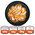 Introducing the Fit-Fil-A: A plate of baked waffle fries loaded with tender smoked chicken breast, shredded cheese, and zesty orange sauce. Each serving provides 490 calories, 41g protein, 38g carbs, and 16g fat—perfect for a healthy dinner.