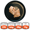 A black plate displays a Grilled Chicken Parmesan Wrap, halved to show its filling and wrapped in a whole wheat tortilla. Nutrition info below: 370 calories, 44g protein, 28g carbs, and 11g fat—making the Grilled Chicken Parmesan Wrap ideal for healthy meal prep.