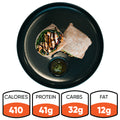 The Grilled Chicken Pesto Wrap, served halved on a black plate with green sauce, is ideal for meal prep. Nutrition: 410 calories, 41g protein, 32g carbs, 12g fat.