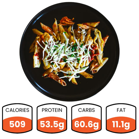 The Harrison Chicken Pasta Bowl features penne pasta with shredded cheese and herbs, delivering 509 calories, 53.5g protein, 60.6g carbs, and 11.1g fat—an ideal high-protein choice for healthy meal prep.