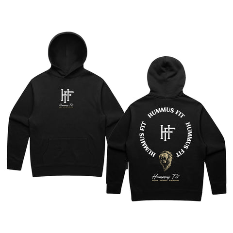 The 2025 Essentials Hoodie in black fuses streetwear with Hummus Fit style, featuring a small “HF” logo and text on the front, plus a bold back design with circular “Hummus Fit” lettering and a lion’s head graphic at the bottom.