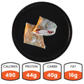 The Meatball Parmesan Wrap (Subscription), packed with 490 calories, 44g protein, 40g carbs, and 16g fat, is shown halved on a black plate—ideal for meal prep.