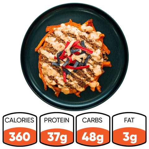The Nacho Average Bowl features sweet potato fries topped with lean ground beef, cheese sauce, and colorful tortilla strips. It has 360 calories, 37g protein, 48g carbs, and 3g fat—making it perfect for a healthy lunch.