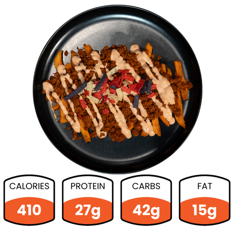 The Nacho Average Vegan Bowl features Beyond Beef crumbles, colorful tortilla strips, and sauce over loaded fries. Nutrition: 410 calories, 27g protein, 42g carbs, and 15g fat.