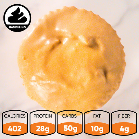 A top view shows a round Buffin Muffin in Basic Baddie Pumpkin with creamy topping. Nutrition: 402 calories, 28g protein, 50g carbs, 10g fat, 4g fiber. A “has filling” icon appears at the top left corner.