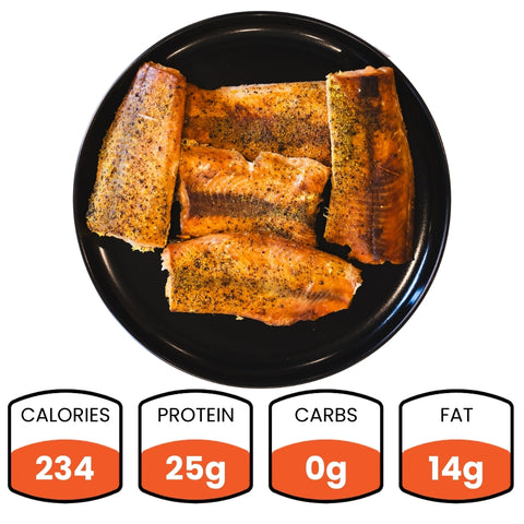 Enjoy Competition Approved Lemon Pepper Salmon (1lb), served as five cooked, seasoned pieces on a black plate. Nutrition: 234 calories, 25g protein, 0g carbs, 14g fat—ideal for high-protein meal prep or low-carb dinners.