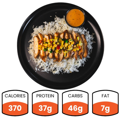 The Southwest Chicken Bowl features white rice, sliced baked chicken breast, and corn salsa with orange sauce on the side. Ideal for meal prep, it delivers 370 calories, 37g protein, 46g carbs, and 7g fat.