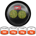 A black plate holds two round green Egg White Muffins and a ketchup packet—ideal for a vegetarian breakfast. Nutrition: 180 calories, 33g protein, 10g carbs, and 9g fat listed below the plate.