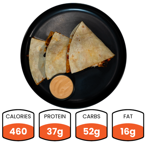Overhead view of three folded Vegan Chorizo Quesadillas on a black plate with dipping sauce. Nutritional info: 460 calories, 37g protein, 52g carbs, 16g fat—a healthy lunch or tasty dinner choice.