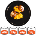 Try Vegan Meatball Sliders—a healthy lunch choice. Two sliders on a black plate provide 400 calories, 24g plant-based protein, 44g carbs, and 16g fat.