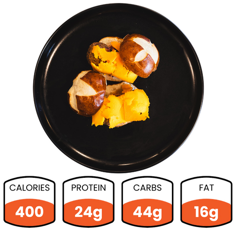 Try Vegan Meatball Sliders—a healthy lunch choice. Two sliders on a black plate provide 400 calories, 24g plant-based protein, 44g carbs, and 16g fat.