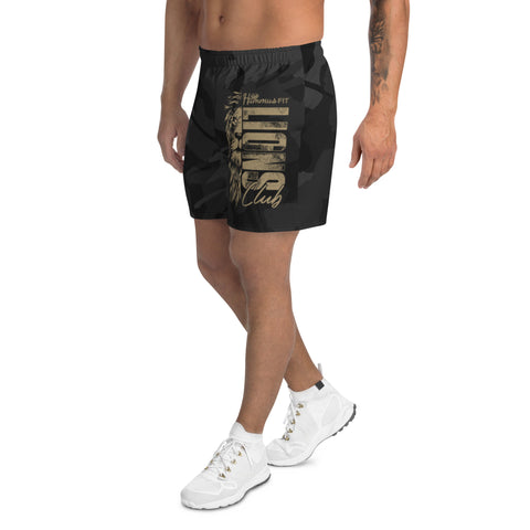 A person wears Mens Athletic Long Shorts in black camo with a gold lion graphic and Lion FIT Club text, styled with a white tee and sneakers, standing against a white background—ideal for versatile sports outfits.