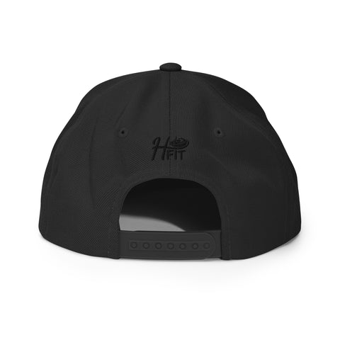 The Black Snapback Hat is shown from the back, highlighting an adjustable strap and H FIT embroidered above the opening.