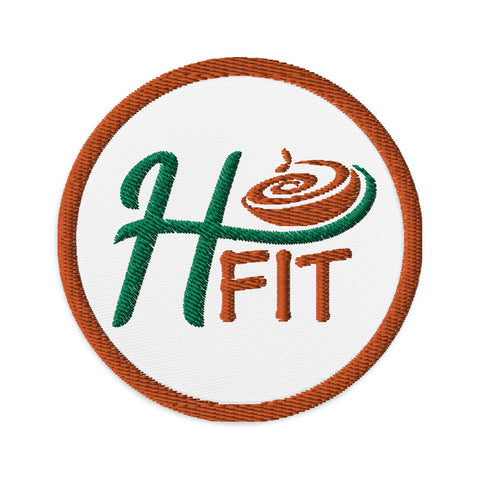 The Embroidered patches feature a circular design with a brown border, a crisp white background, and H FIT inside—the H in green, FIT in brown with a swirl above the I—perfect for sewing onto clothing or accessories.