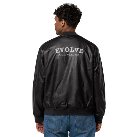 A man stands with his back to the camera, hands by his sides, wearing blue jeans and the Lions Club Leather Bomber Jacket—classic black PU leather with EVOLVE and Humans of New York printed in white on the back.