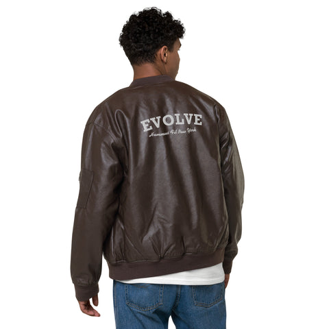 A person with short curly hair wears the Lions Club Leather Bomber Jacket with EVOLVE and American Idol New York on the back, paired with blue jeans and a white shirt, standing facing away.