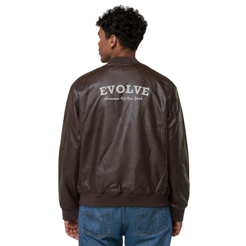 A person faces away from the camera, wearing the Lions Club Leather Bomber Jacket in classic brown PU leather with EVOLVE and Human Made New York text on the back, paired with blue jeans.