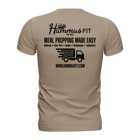 The Unisex Hummus Fit New York Desert Dust T-Shirt features the logo, “Meal Prepping Made Easy” above a delivery truck with Nationwide Shipping, location details, www.hummusfit.com, and an eco-friendly design.