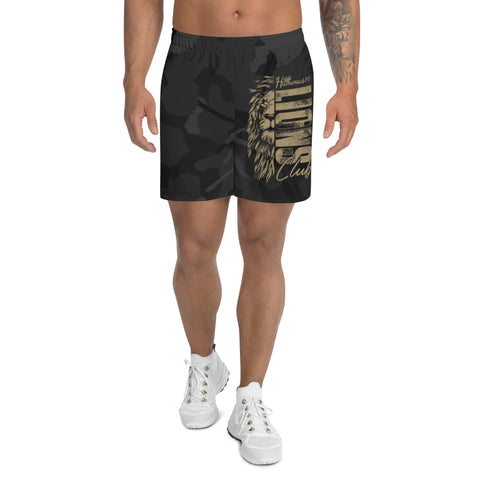 A man models the Mens Athletic Long Shorts in black camo with a gold lion graphic and script on one leg, styled with white sneakers against a white background—ideal for versatile sports outfits.