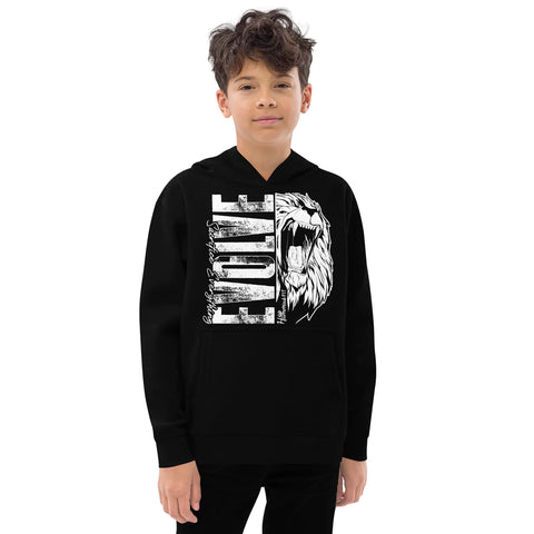 A boy models the Unisex Kids Fleece Hoodie in black, featuring a white EVOLVE text and roaring lion graphic on the front, made from soft, durable fleece, against a plain white background.