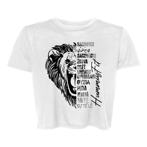 Women’s Crop Tee in white slim fit, featuring a black roaring lion graphic on the left and “SACRIFICE” and “HUMILITY” in various languages with vertical script on the right—a stylish, trendy choice.