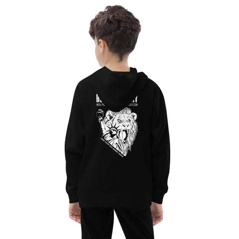 A young boy with curly hair, wearing the Unisex Kids Fleece Hoodie in black, stands facing away. The hoodie, made from soft and durable fleece, features a white lion and microphone graphic on the back against a plain backdrop.