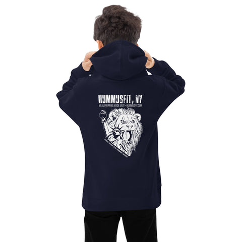 A person faces away, wearing a Unisex Kids Fleece Hoodie in navy with the hood up. The soft, durable fleece features a white lion holding a microphone and HUMMUSFIT, NY Meal Prep & Grab N Go graphic.