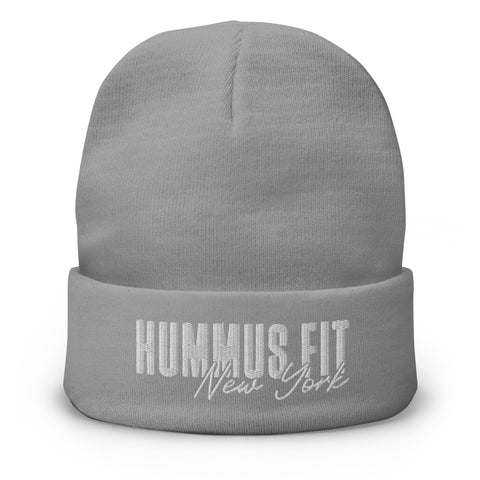 The Hummus Fit NY Embroidered Beanie is a light gray cotton blend hat featuring HUMMUS FIT New York stitched in white on the front cuff.