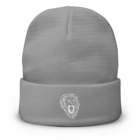 The Unisex Embroidered Beanie is a light gray cotton blend with a folded brim and features a white roaring lion’s head embroidered on the front center.