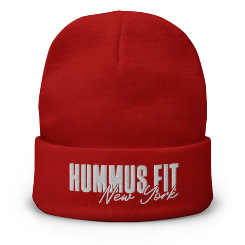 The Hummus Fit NY Embroidered Beanie is a red cotton blend hat with HUMMUS FIT New York stitched in bold white and cursive on the front of its folded brim.