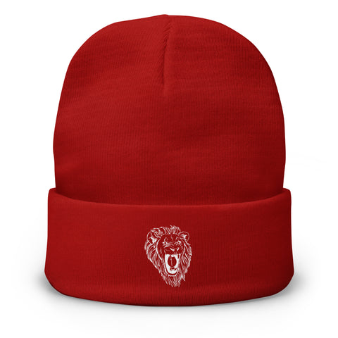 The Unisex Embroidered Beanie is a bright red cotton blend hat with a folded brim, featuring a white embroidered outline of a roaring lion’s head on the front.