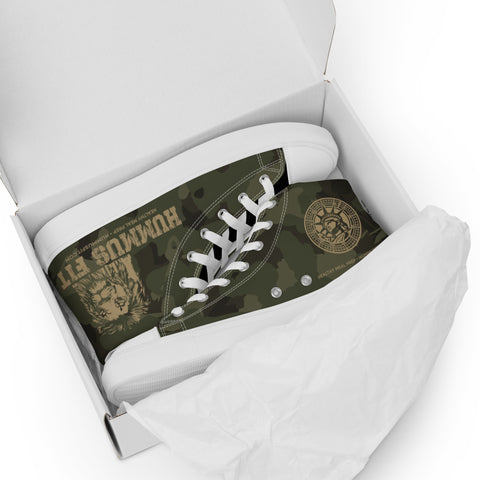 A pair of Men’s Army Camo High Top Canvas Shoes featuring a green camouflage print, white laces, a lion graphic, and an emblem with text, packaged in a shoebox and partially covered by white tissue paper.