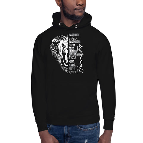 A man wears the Unisex Hoodie, a soft streetwear piece with a black lion face design. Inspirational words like sacrifice and humanity in multiple languages create the mane, and it features a comfy pouch pocket.