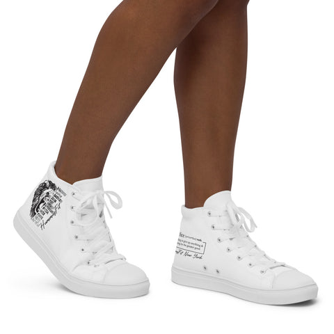A person wearing Women’s high top canvas shoes featuring black graphic designs and handwritten text on the sides, standing on a white background.