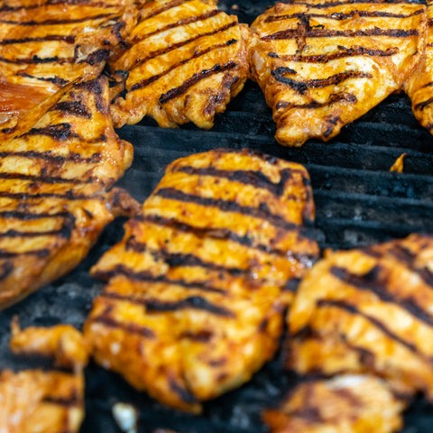 chicken breasts on a grill